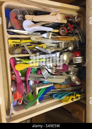 Messy cutlery drawer Stock Photo