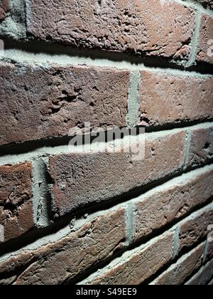 Close up of a lit brick wall Stock Photo