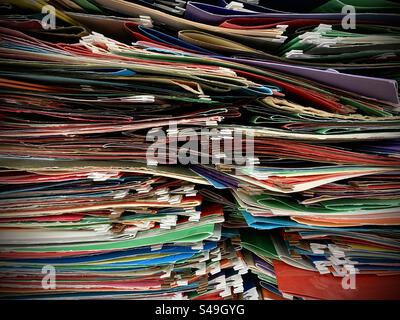 A large pile of empty colourful file folders. Stock Photo