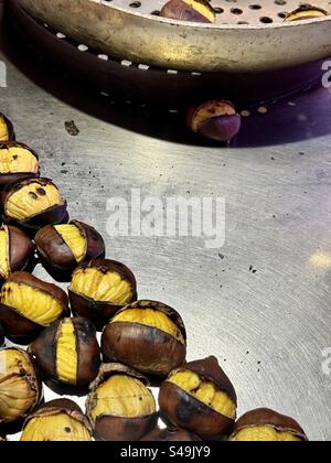 Hot Roasted chestnuts at street vendor in Athens, Greece. Tasty delicacy Stock Photo