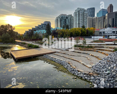 The lagoon at Eau Claire in downtown Calgary, Alberta, Canada, at sunrise in autumn. Stock Photo