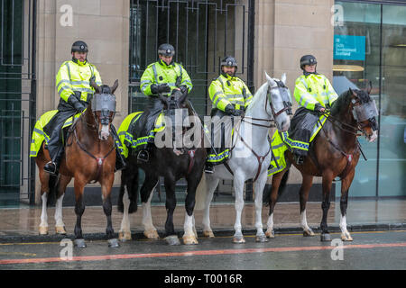 Glasgow, Scotland, UK. 16th Mar, 2019. Several hundred demonstrators turned up, despite the heavy rain, to take part in the Stand up to Racism March through Glasgow city centre as part of the worldwide 'Stand up to Racism' campaign. Several interest groups took part including Pro-Palestine and Anti-Semitic supporters requiring the substantial police presence to keep them apart although all were allowed to take part in the parade. Credit: Findlay/Alamy Live News Stock Photo