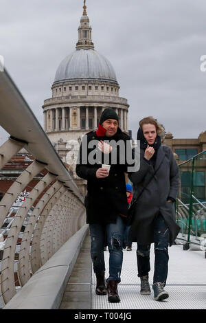 London, UK. 16th March 2019. Millennium Bridge. London, UK 16 Mar 2019 - People walking against strong wind on Millennium Bridge in London as gale force winds gusting between 45mph to 55mph.   Credit: Dinendra Haria/Alamy Live News