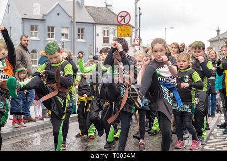 Athlone Town, Ireland. 16th March 2019. The kids from teh Athlone Kickboxing Club shoing off their moves during the 2019 4Athlone St Patricks Day Parade. Credit: Eoin Healy/Alamy Live News Stock Photo