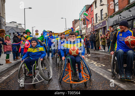 Athlone Town, Ireland. 16th March 2019. The Athlone Wheelchair Basketball team marching up the recently redesigned Church Street for the 2019 Athlone St. Patricks Day Parade. Credit: Eoin Healy/Alamy Live News Stock Photo