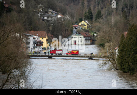 Passau, Germany. 16th Mar, 2019. Fire engines are standing on the Ilz bridge in the Hals district while the Ilz is flooded. The flood of the Ilz has flooded streets and plots of land in parts of Passau and has filled up cellars. Credit: Tobias Köhler/dpa/Alamy Live News Stock Photo