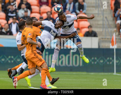 Compass Stadium, Houston, Texas, USA. March 16, 2019: Vancouver Whitecaps defender Derek Cornelius (13) and forward Alhassane Bangoura (19) go up for the header in front of the goal during the match between the Vancouver Whitecaps FC and the Houston Dynamo at BBVA Compass Stadium in Houston, Texas The score at the half Dynamo is in the lead 2-1 © Maria Lysaker/CSM. Stock Photo