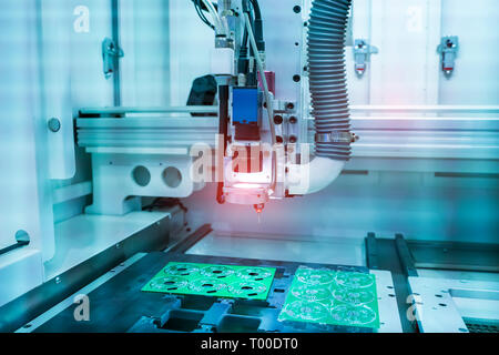 PCB Processing on CNC machine working in factory Stock Photo