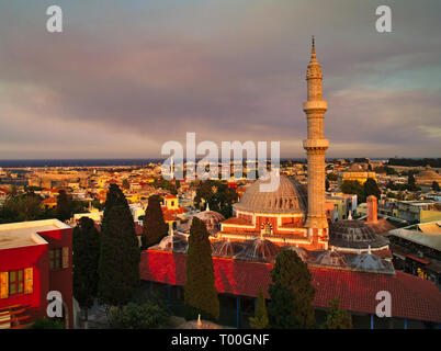 View of Rhodes island, Greece, with Suleiman Mosque at sunset time. Stock Photo