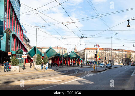 MILAN, ITALY - FEBRUARY 24, 2019: people on square Piazzale Cadorna near building of railway station Milano Cadorna in Milan city. Milan is capital of Stock Photo