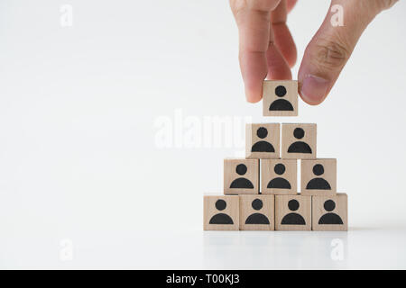 Businessman stacking wooden team blocks Stock Photo