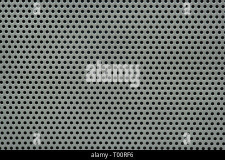 Gray background of metal mesh in the hole close-up Stock Photo