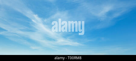 White cirrus fuzzy clouds in the blue azure sky. Summer good weather background. Stock Photo