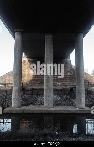 concrete bridge columns, the reflection in the river Stock Photo