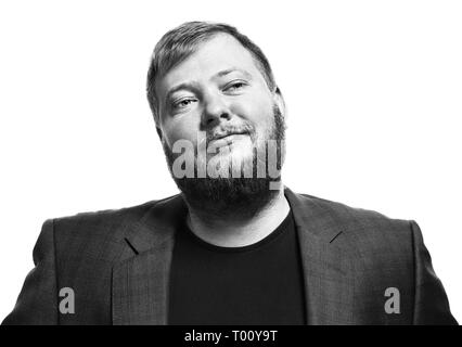 Close-up black and white portrait of a brooding bearded man. Blue jacket in business look. Isolated on white background Stock Photo