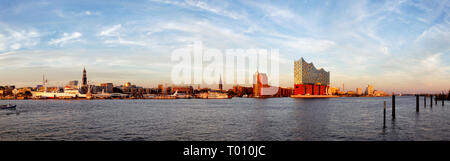 Panorama of the harbour of Hamburg with the Elbphilharmonie in evening light. Stock Photo
