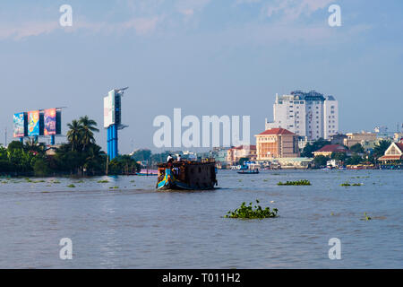 Hau River scene with clumps of Water Hyacinth floating downstream in Mekong Delta. Can Tho, Vietnam, Asia Stock Photo