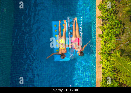 Aerial view of inflatable mattress in swimming pool - summer fun and ...