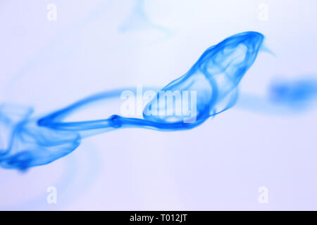 Ink Drop Mystic Magic Dynamic Motion in Water. Soft Background. Stock Photo