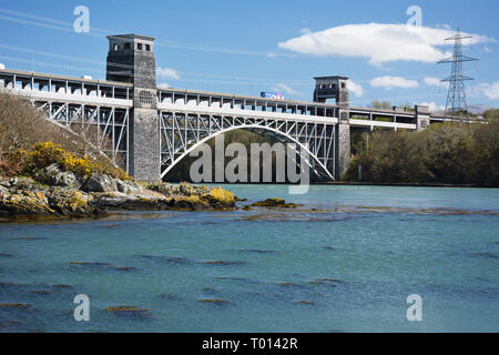 The Britannia bridge with the Menai Strait in the foreground. This bridge carries both rail and road traffic from the Welsh mainland to Anglesey Stock Photo