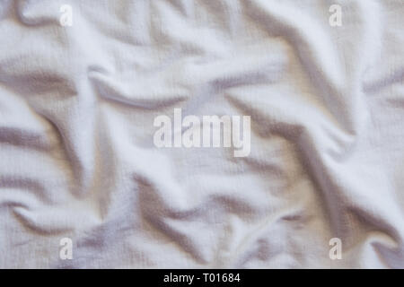 Crumpled white Cotton Fabric Texture. Stock Photo