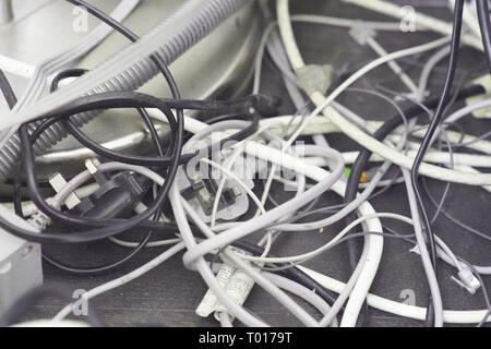 Messy wires in a home office. Stock Photo