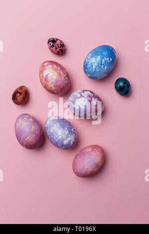 Stylish background of colorful Easter eggs isolated on pink. Dyed Easter eggs. Top view, concept of Easter eggs Stock Photo