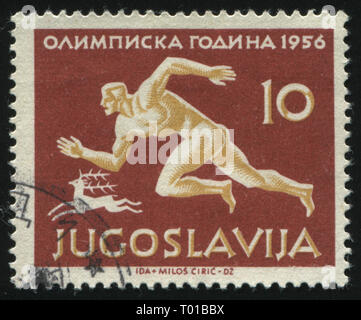 RUSSIA KALININGRAD, 12 NOVEMBER 2016: stamp printed by Yugoslavia, shows Runner, circa 1956 Stock Photo