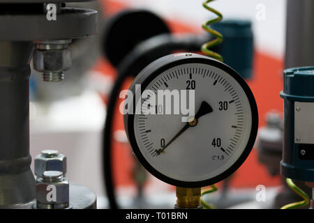 Closeup view of a pressure gauge meter. Selective focus. Stock Photo