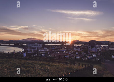 Jeju island, South Korea, September 09, 2015: view on sunset at Jeju island from parking lot near seongsan park Stock Photo