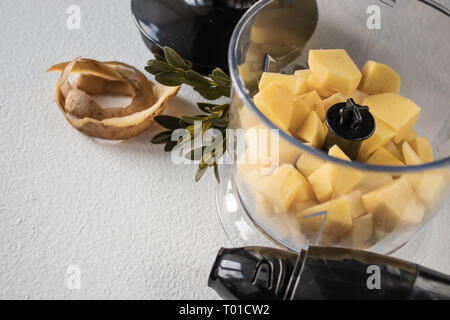 Peeled potatoes and cut into cubes, pieces. The process of cooking. Natural Potatoes Stock Photo