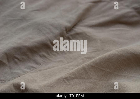 folded linen fabric background texture selective focus Stock Photo