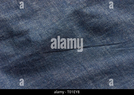 blue creased  fabric background texture selective focus Stock Photo