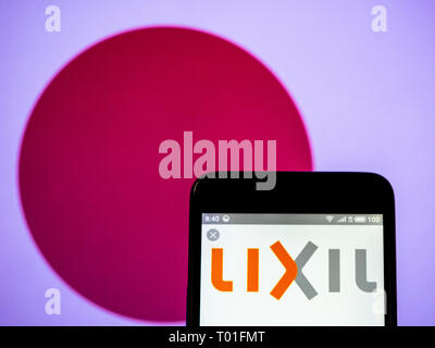 Lixil Group Corporation  logo seen displayed on smart phone. Stock Photo