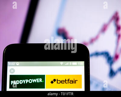 Paddy Power logo seen displayed on smart phone. Stock Photo