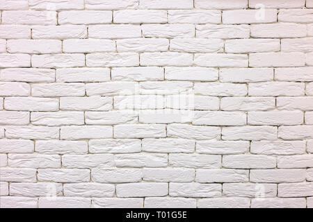 Close-up of white painted whitewashed solid brick wall. Abstract copy space background, Bricklaying, construction and masonry concept. Stock Photo