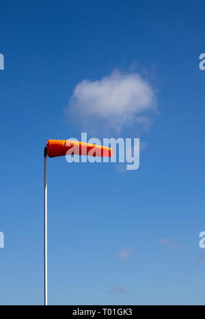 Airfield windsock, used to indicate wind speed and direction, shown ...