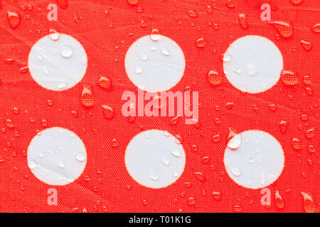 water drop on a waterproof fabric point Red and white beautiful background  with copy space Stock Photo