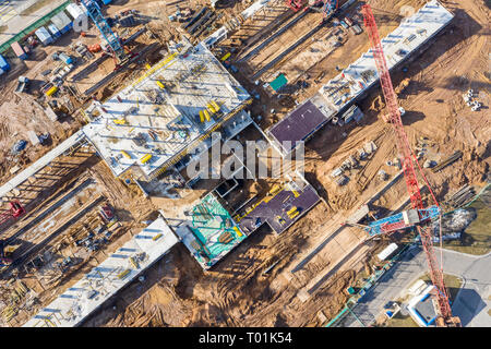 birds eye view on construction site with tower cranes and future building Stock Photo