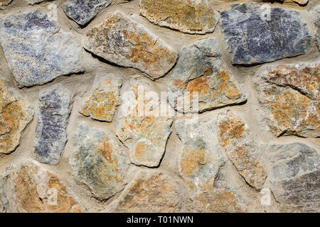Wall of granite stones Stock Photo