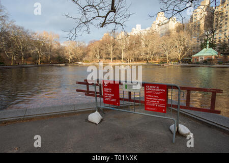 An Ice Rescue Ladder Station beside Conservatory water, a lake in Central Park, New York City, NY, USA. Stock Photo