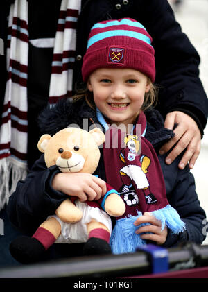 A young West Ham United fan in the stands during the Premier League match at London Stadium. Stock Photo