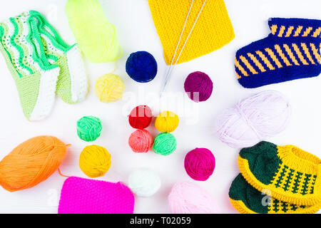 knitting ball of yarn and knitting needles on a white background Stock Photo