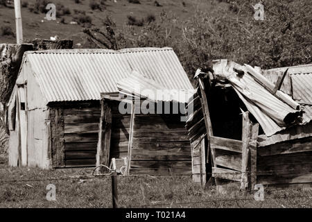 Tumbled down old farm buildings Stock Photo