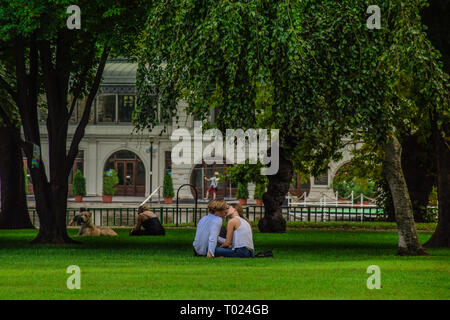 Budapest, Hungary, September , 13, 2019 - People kissing in a date at Varosliget park ina a sunny day Stock Photo