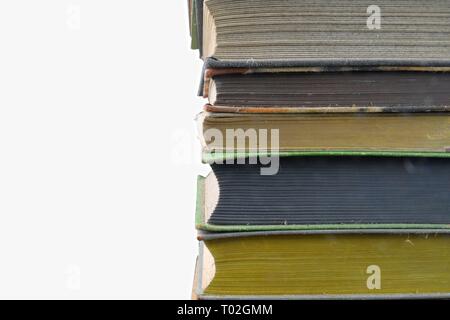 Stack of hardcover vintage books isolated with copy space. White background. Stock Photo