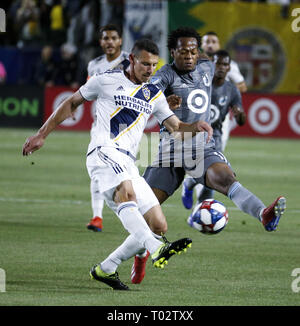 Los Angeles, California, USA. 16th Mar, 2019. Minnesota United midfielder Romario Ibarra (11) of Ecuador, and LA Galaxy defender Daniel Steres (5) vie for the ball during the 2019 Major League Soccer (MLS) match between LA Galaxy and Minnesota United in Los Angeles, California, March 16, 2019. Credit: Ringo Chiu/ZUMA Wire/Alamy Live News Stock Photo