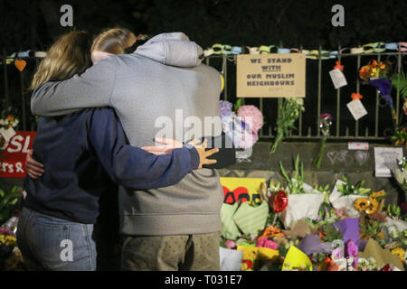 Christchurch, New Zealand. 16th March 2019. People seen comforting themselves while paying respect to the victims of the Christchurch mosques shooting. Around 50 people has been reportedly killed in the Christchurch mosques terrorist attack shooting targeting the Masjid Al Noor Mosque and the Linwood Mosque. Credit: SOPA Images Limited/Alamy Live News Stock Photo