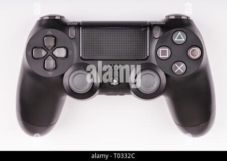 ATLANTA, GEORGIA - March 2, 2017: A wireless Playstation 4 game controller on a white background Stock Photo