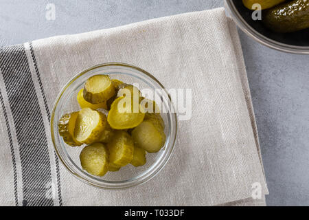 Homemade pickled fresh cucumbers, on a white background. Stock of food. Autumn concept. Top view, soft focus. Stock Photo